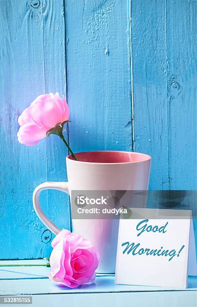 Mug With Roses On Blue Wood Background With Good Morning Text Stock Photo - Download Image Now