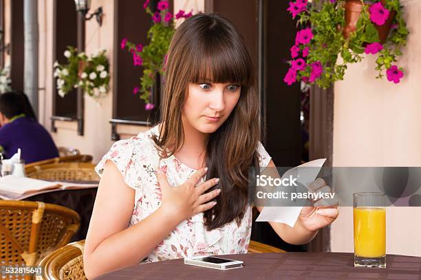 Woman Unhappy Amount Of The Invoice Stock Photo - Download Image Now - Restaurant, Financial Bill, Shock