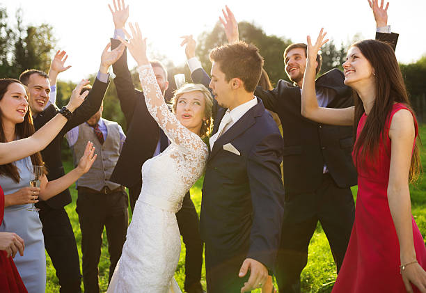 istock Newlyweds with guest on their garden party 532815821