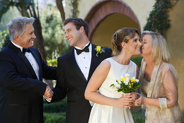 istock Bride, groom and parents exchanging wishes 532817495