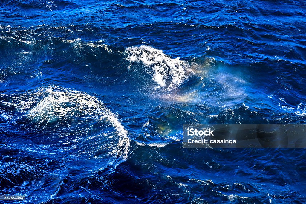 Waves and foam on the surface of the North Sea Blue turbulent waters of the North Sea 2015 Stock Photo