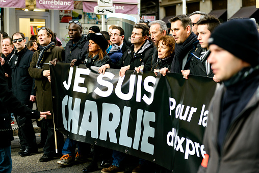 Lyon, France - January 11, 2015: demonstration in solidarity with the attack against Charlie Hebdo in Lyon, France on 11 January, people holding a sign. 