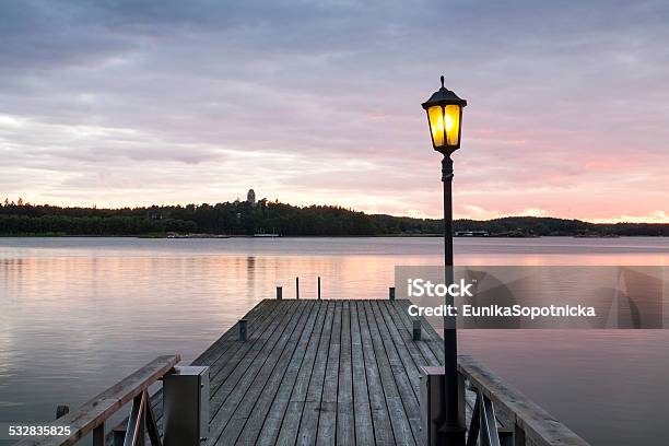 Wooden Jetty With One Lamp On It Stock Photo - Download Image Now - 2015, Backgrounds, Beach