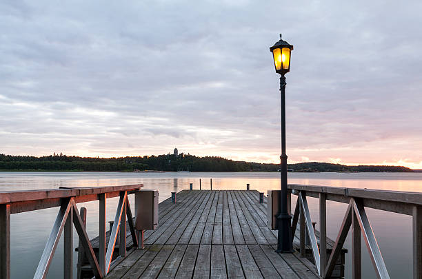 istock Wooden jetty with one lamp on it. 532837451
