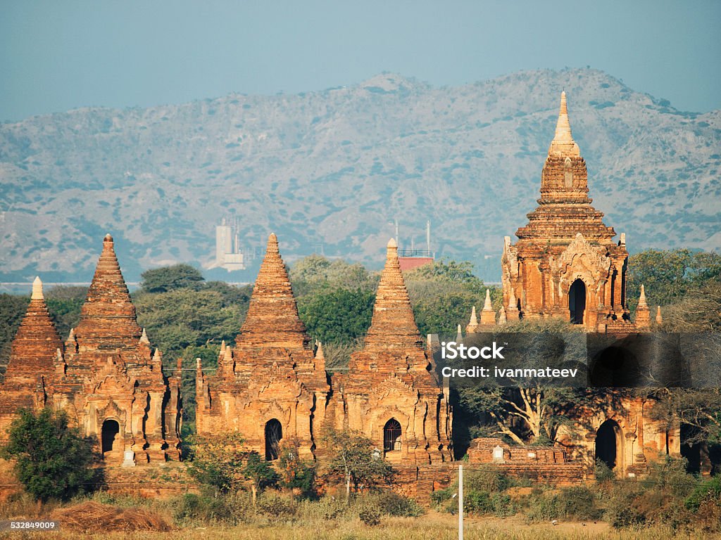 Ancient pagodas in Bagan, Myanmar Ancient pagodas in Bagan, blue sky in background Ancient Civilization Stock Photo