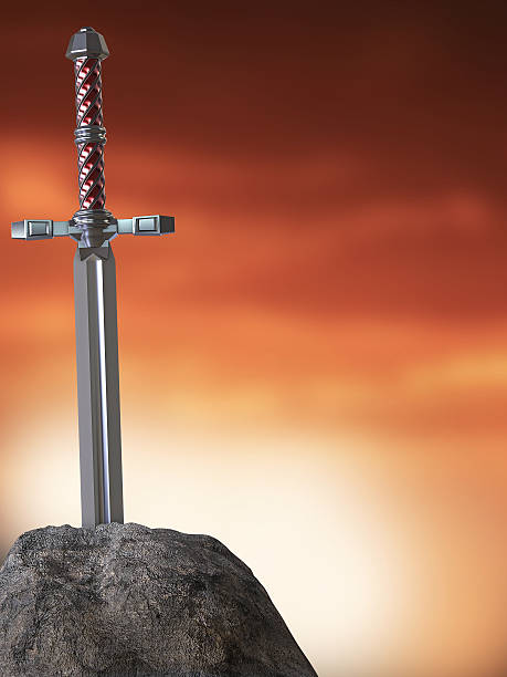 istock sword excalibur  King Arthur stuck in the rock stone isolated 532850218