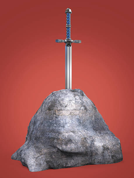 istock sword excalibur  King Arthur stuck in the rock stone isolated 532850272