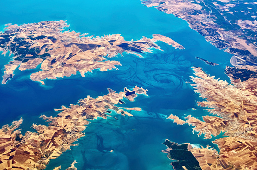 Aerial view about 9000 m height. Flying over the Ataturk lake on Euphrates River, Turkey
