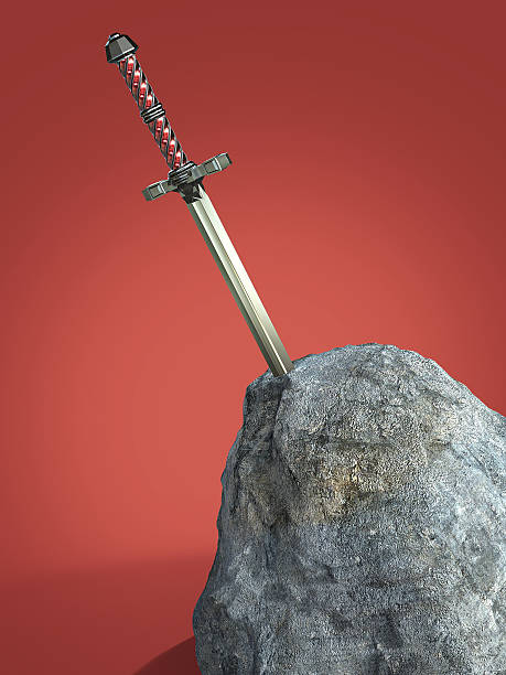 istock sword excalibur  King Arthur stuck in the rock stone isolated 532850402