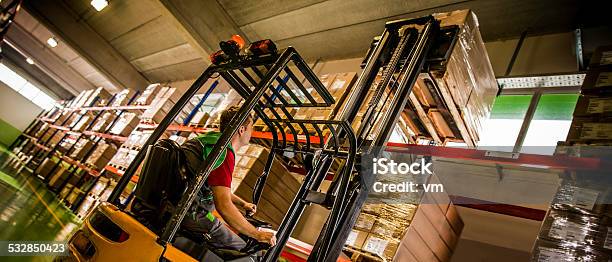 Forklift Operator Loading A Pallet Stock Photo - Download Image Now - Forklift, Operating, Warehouse Worker