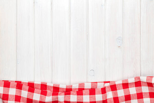 istock Red towel over wooden kitchen table 532850941