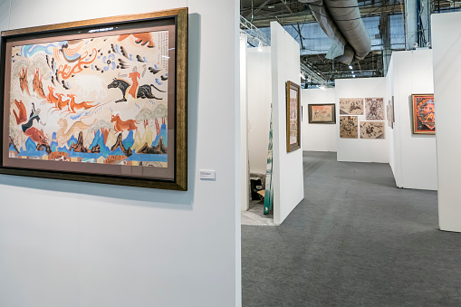 Newyork, USA - April 17, 2016: Appearence from NewYork ArtExpo 2016.   pictures on the wall and waiting for visitors. International Artexpo is the worlds largest fine art trade show, providing dealers, collectors and buyers with access to thousands of innovative works from artists and publishers in one single venue.