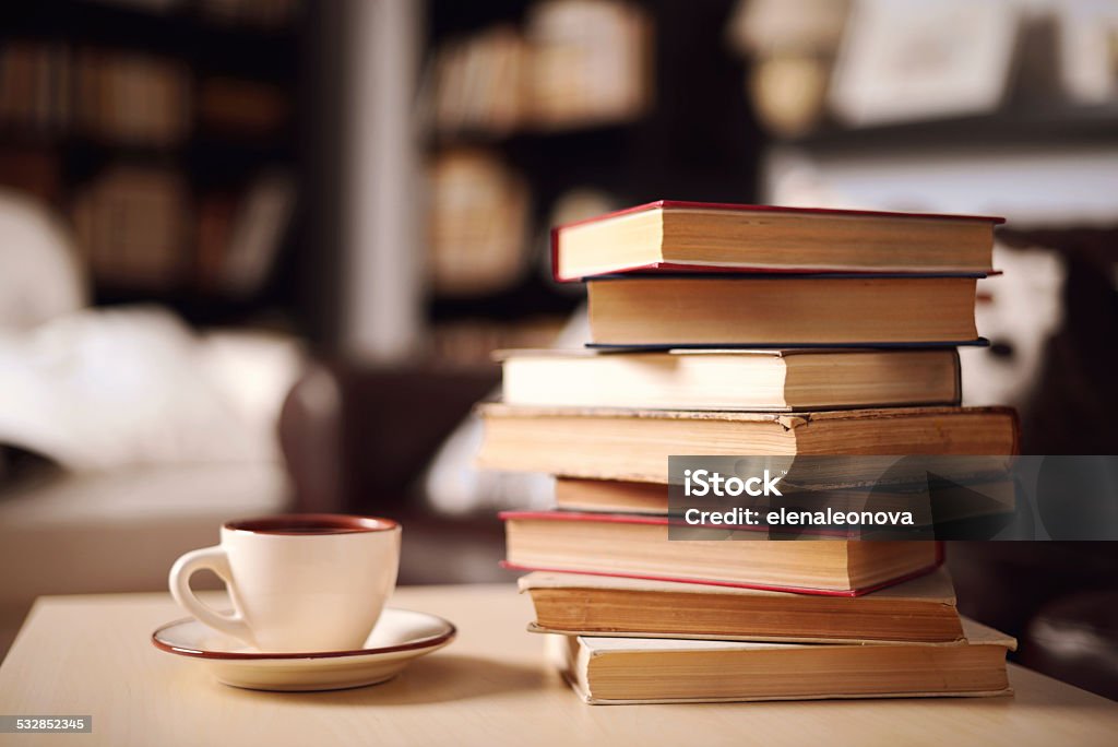 stack of books in home interior Book Stock Photo