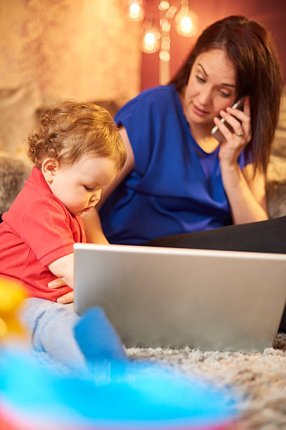 istock Young mother trying to work from home 532852410