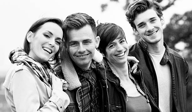 istock Four vibrant healthy friends group portrait black and white 532852433