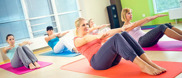 istock Group of women on exercising mats at a Pilates class 532853643