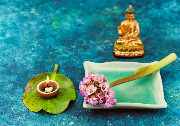 istock Spa composition with pink flowers and Buddha statue 532853698
