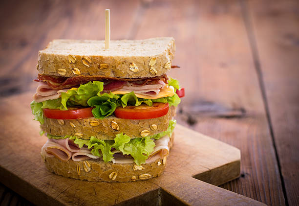 pyszne kanapki na stole - sandwich delicatessen bacon lettuce and tomato mayonnaise zdjęcia i obrazy z banku zdjęć