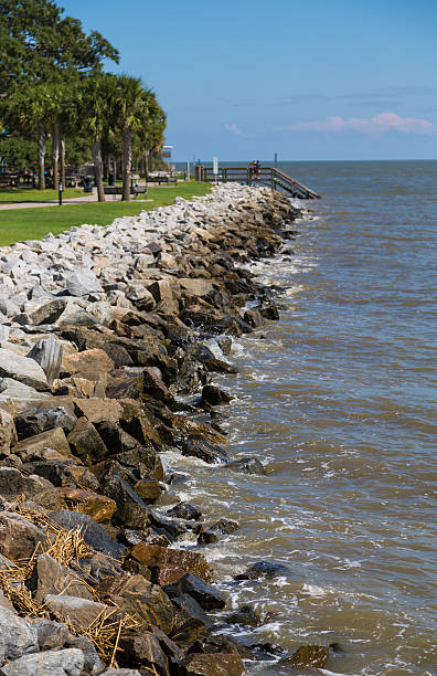 istock Surf Hitting a Seawall on the Coast of Georgia 532854501