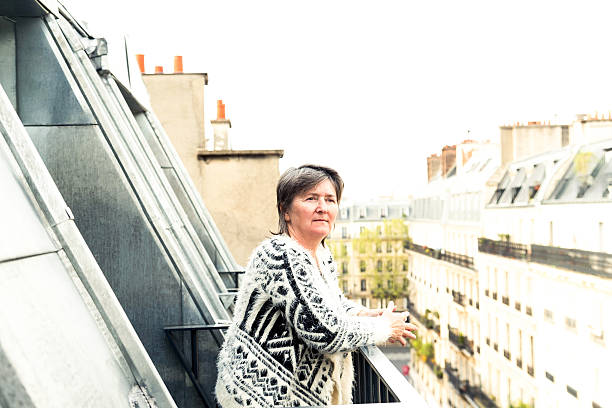 istock senior woman on hotel balcony 532855956