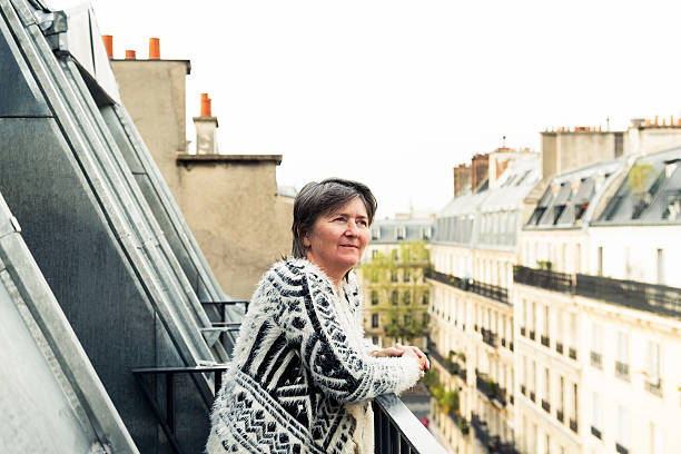 istock senior woman on hotel balcony 532855984