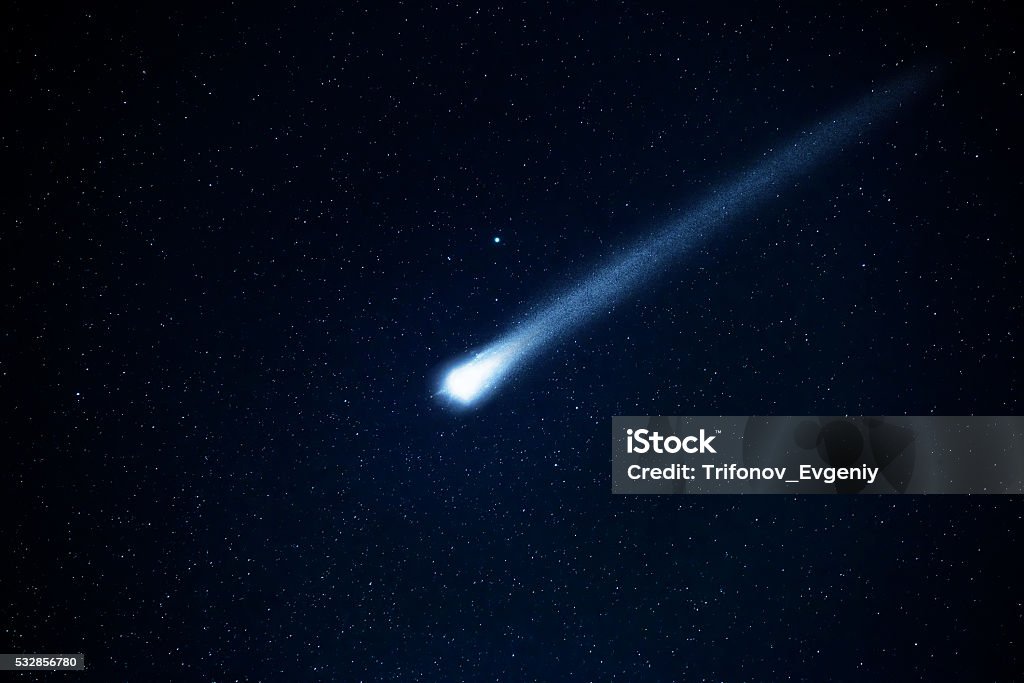 Comet in the starry sky. Elements of this image furnished by NASA. Meteor Stock Photo