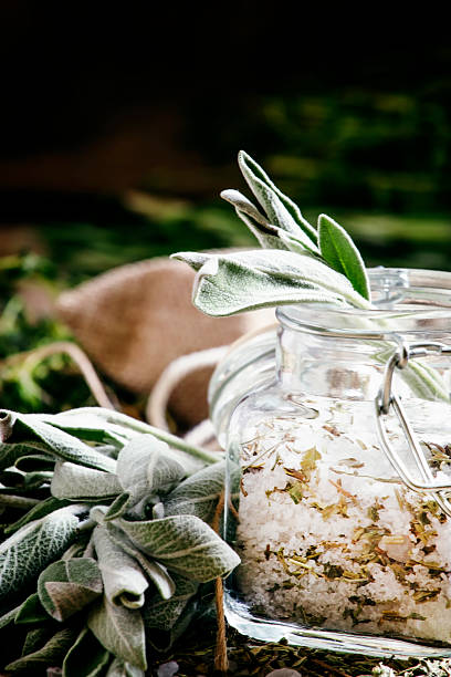 istock Sea salt, milled with sage in a glass jar 532857666