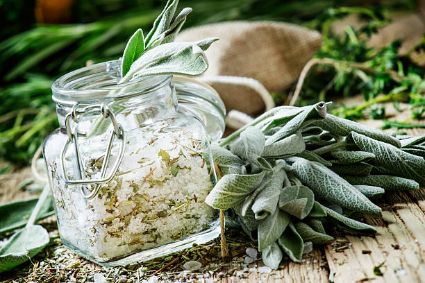 istock Sea salt, milled with sage in a glass jar 532858196
