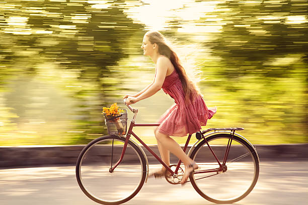 istock Young woman and bike 532859866