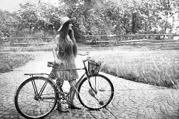 istock Young woman and bike 532860098