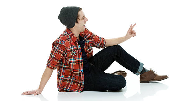istock Cheerful hipster showing victory sign 532860148