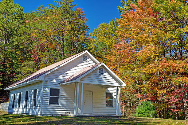 istock Little white church in fall. 532860764