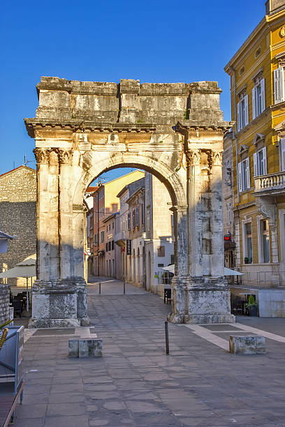 istock Golden Roman Gate (Sergius Arch) in Pula, Croatia 532864234