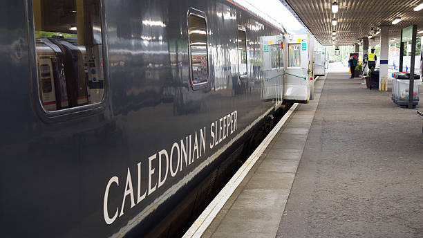 Calednian Sleeper Fort William, Scotland - May 16, 2016: The Caledonian Sleeper train awaits departure from Fort William station for London Euston. fort william stock pictures, royalty-free photos & images