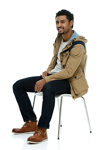 istock Smiling casual man sitting on chair 532866766