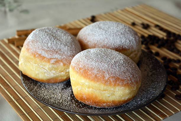 istock Donuts with powdered sugar on the brown plate 532866767