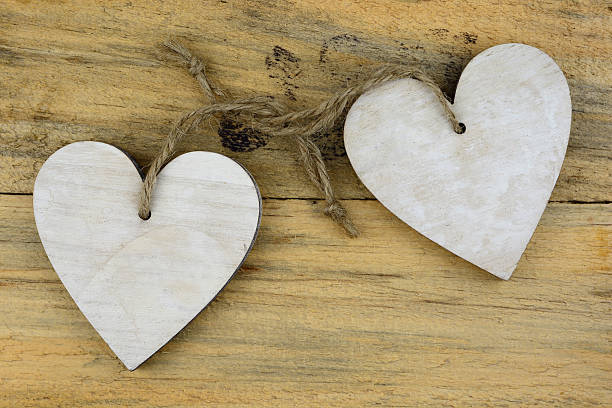 istock Two wooden heart decoration on old wood 532868367