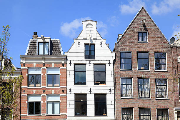 Traditional dutch medieval buildings in Amsterdam, Netherlands Traditional dutch medieval buildings in Amsterdam, Netherlands jordaan amsterdam stock pictures, royalty-free photos & images