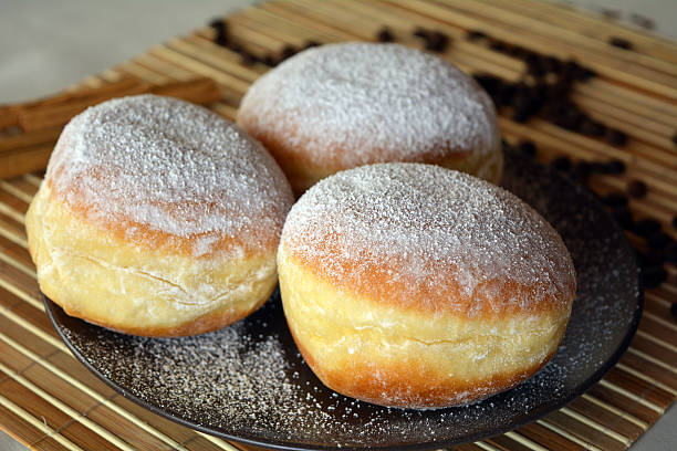 istock Donuts with powdered sugar on the brown plate 532868949