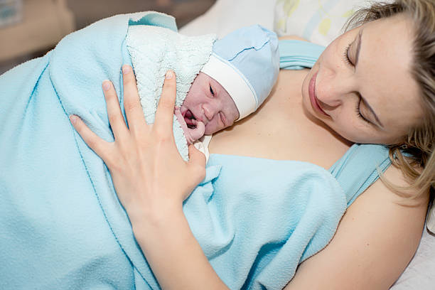 istock Young beautiful woman with a newborn 532869033