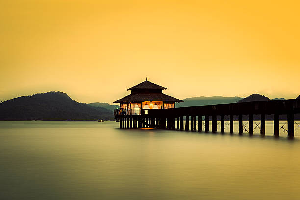 istock jetty silhouette at sunset in malaysia 532869187