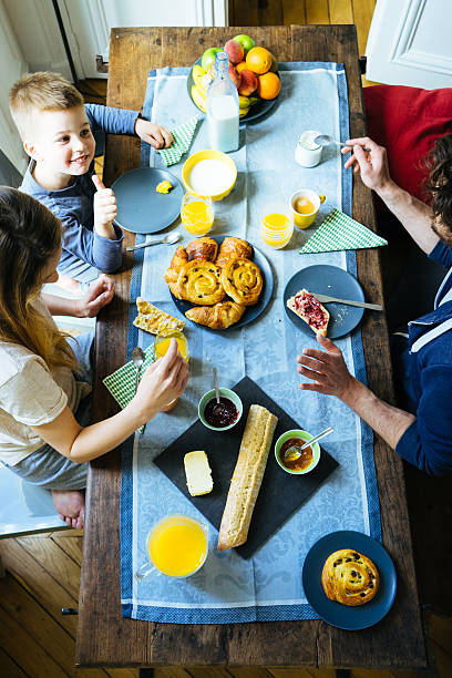 istock Happy Family Having Breakfast Together Overhead View 532870830