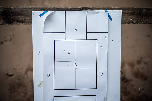 Target with bullet holes stock photo