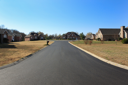 Spring Hill, Tennessee – November 20, 2010: New asphalt topcoat on Quail Circle in the Hunters Point subdivision completes improvements.