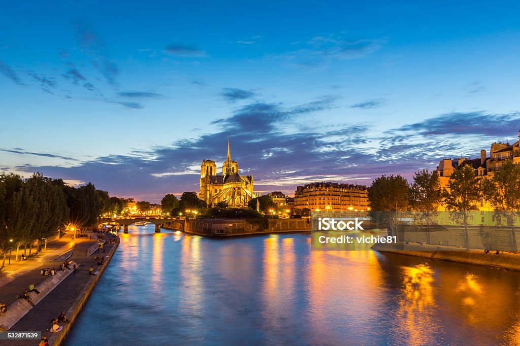 Notre Dame Cathedral Paris dusk Notre Dame Cathedral with Paris cityscape and River Seine at dusk, France 2015 Stock Photo