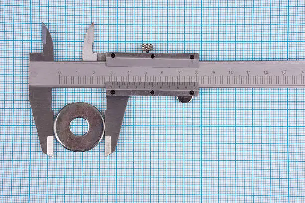 Measurement of bolt spacer diameter with vernier-caliper