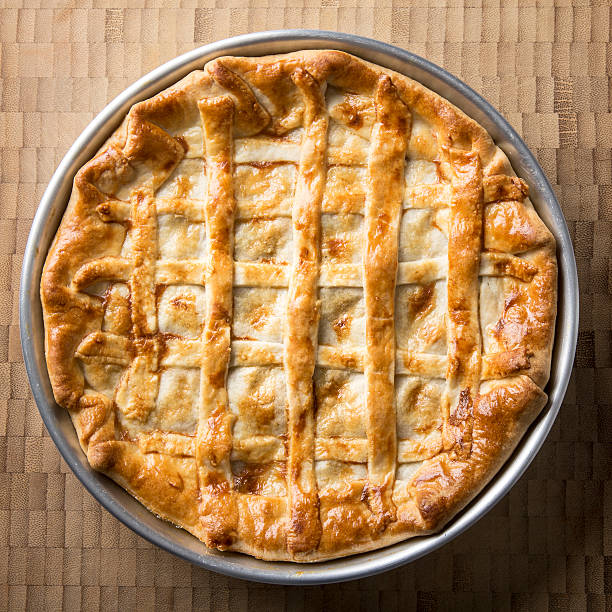 istock Rustic meat striped pie on a wooden background 532872220