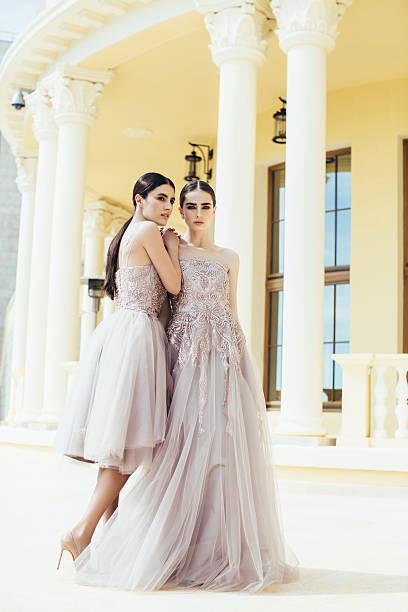 istock Two beautiful girls wearing dresses 532872296
