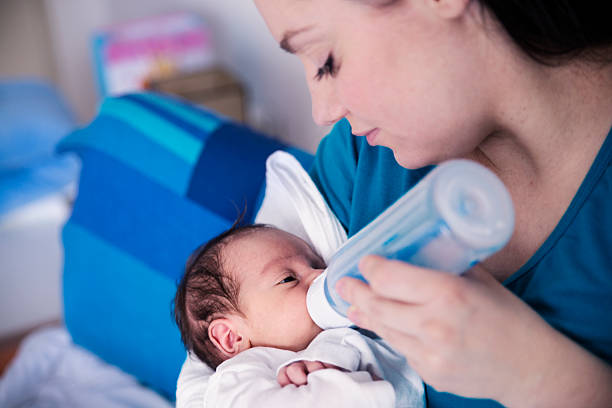 istock Little pretty baby drinking milk 532874024