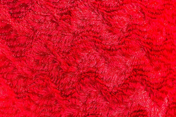istock red faux fur texture background 532875092